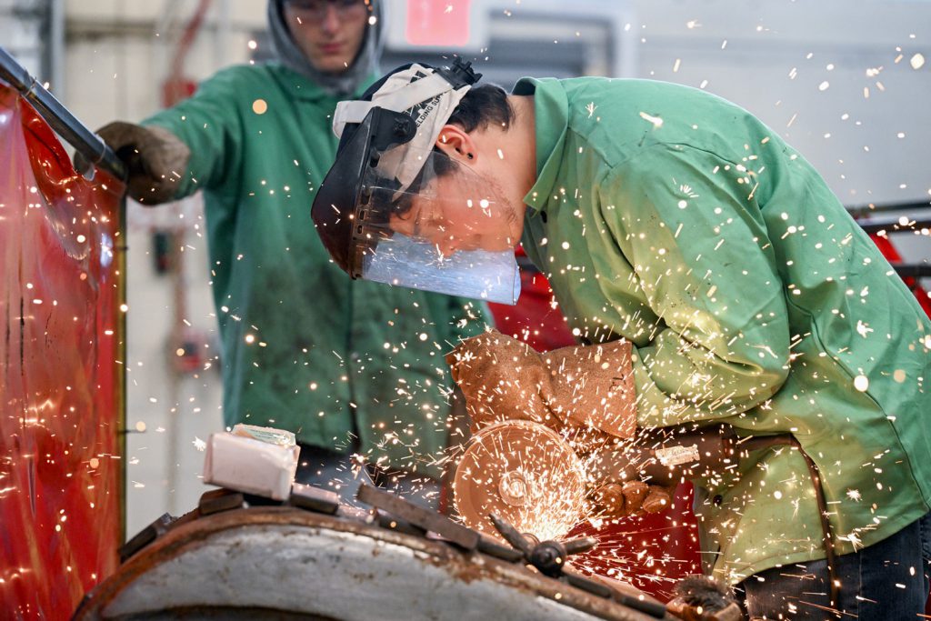 student in metal working class