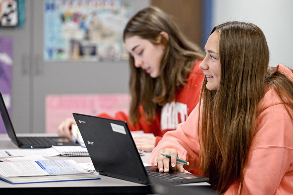 image of students working in class with technology