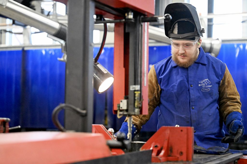 student in metal working class