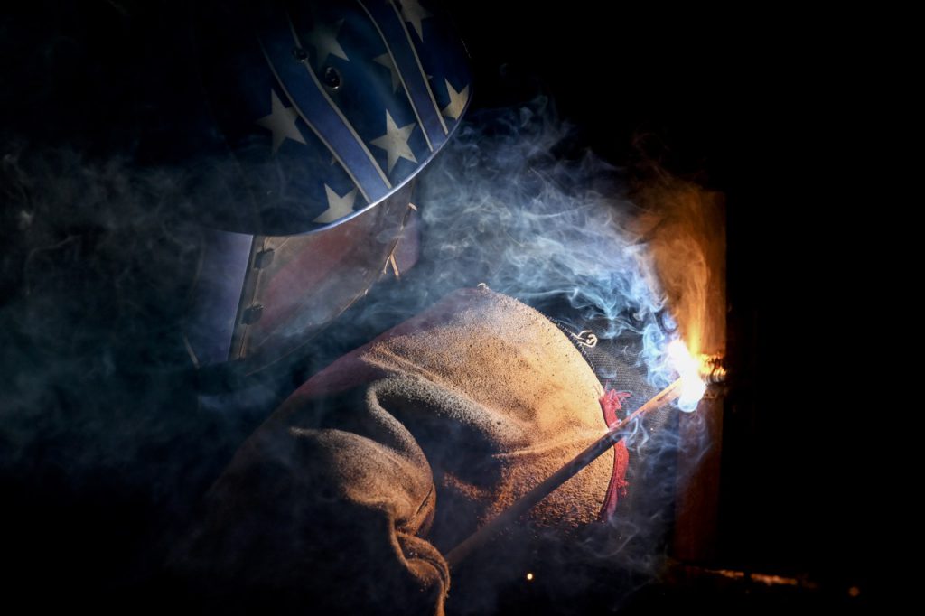 student in metal working class