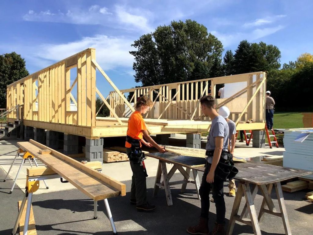 students performing construction work