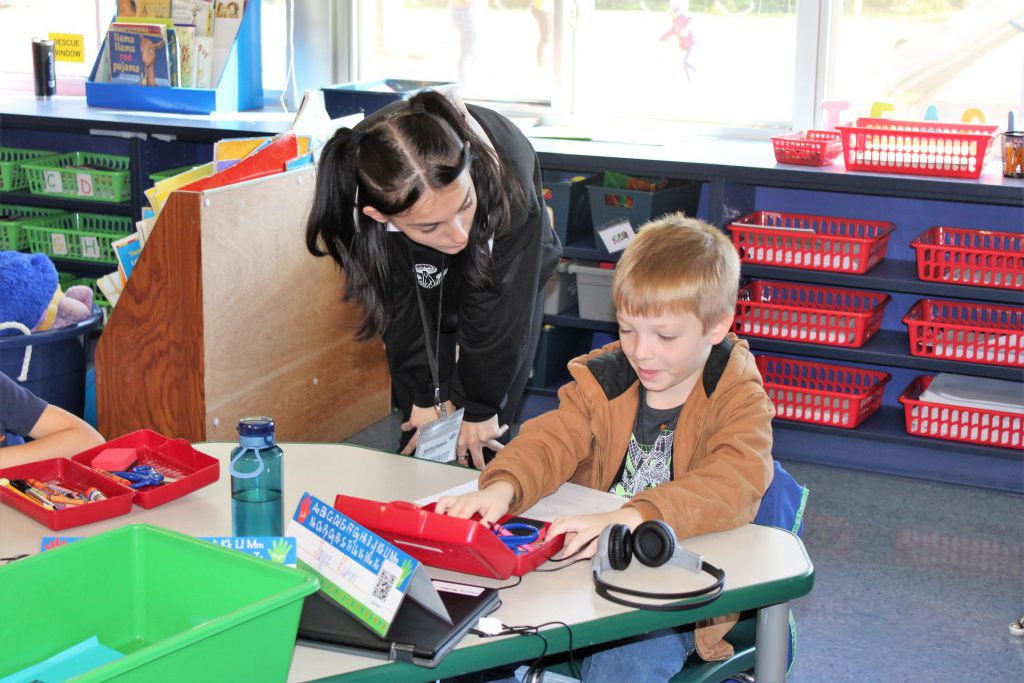 BOCES student working with a young child