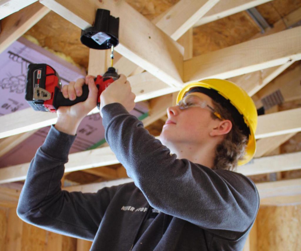 student performing construction work